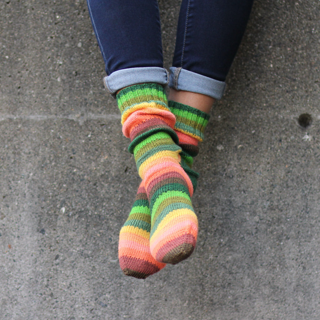 Azurite B classic orange and green self striping sock yarn from gauge dye works