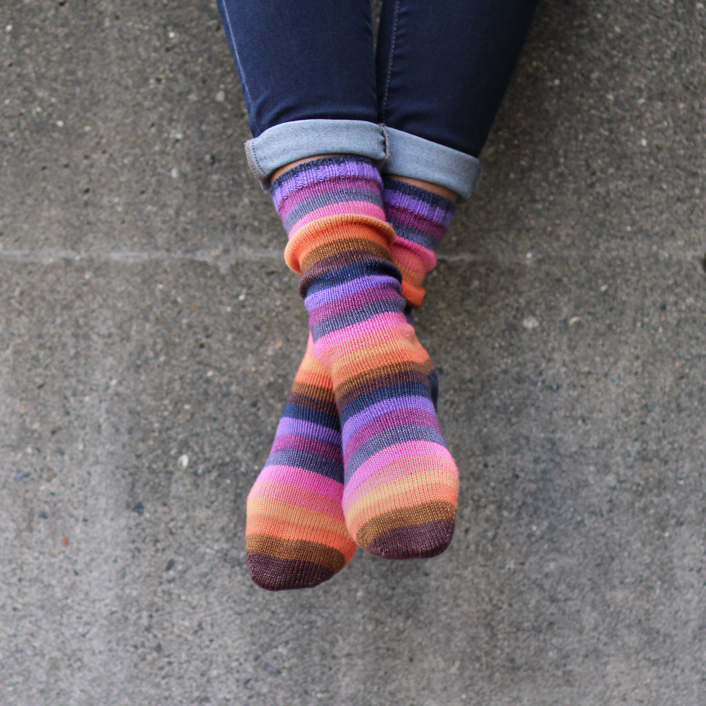 Azurite D orange and purple self striping classic sock yarn from gauge dye works