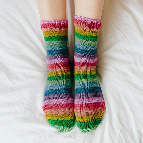 White Light self striping patterning sock yarn from Gauge Dye Works, Smooth Operator knitting pattern by Susan B Anderson