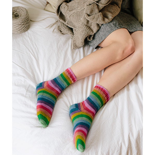 White Light self striping patterning sock yarn from Gauge Dye Works, Smooth Operator knitting pattern by Susan B Anderson