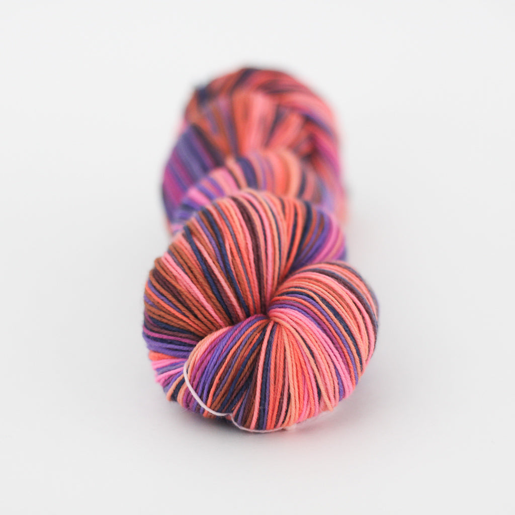 Azurite D orange and purple self striping classic sock yarn from gauge dye works