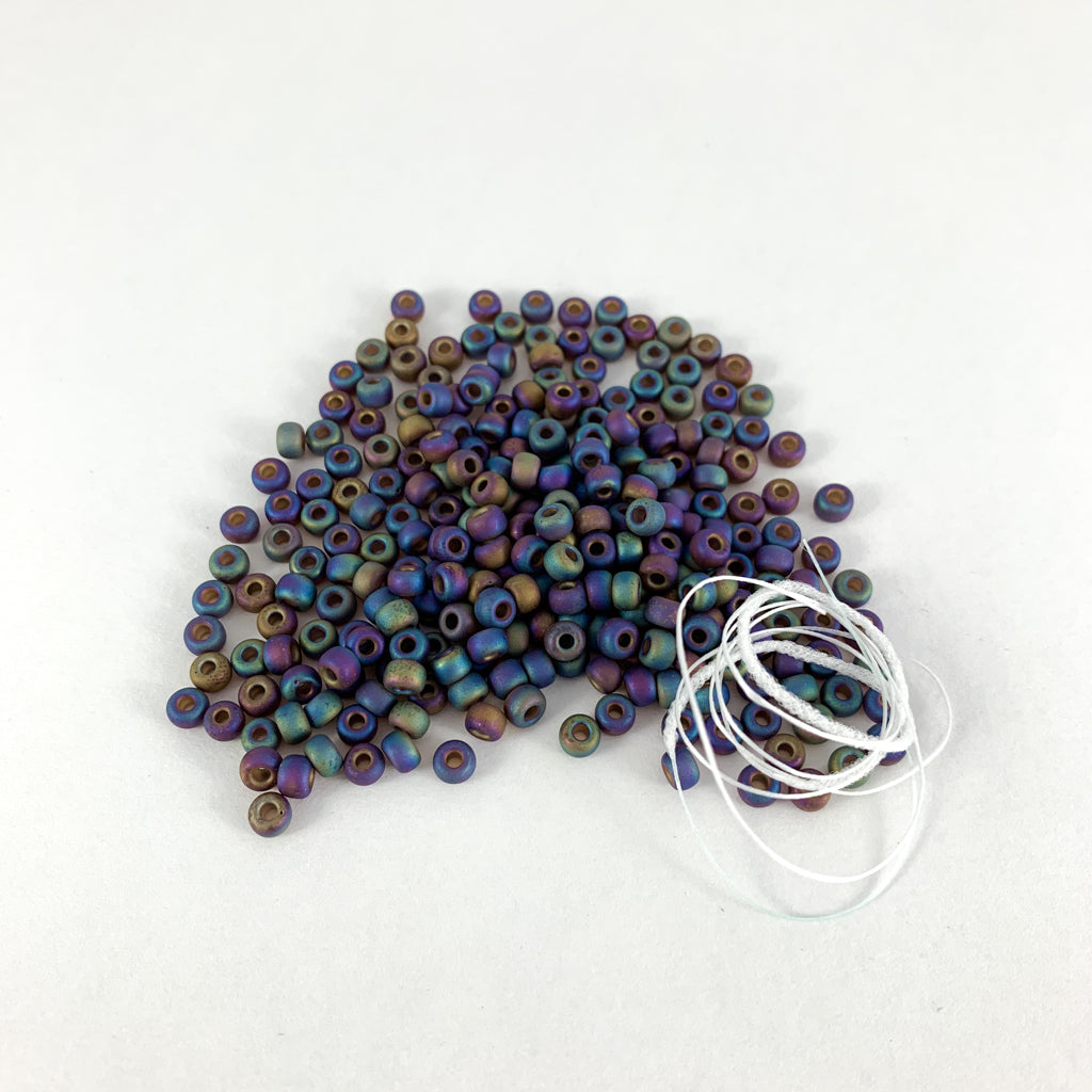  Tesserae self patterning yarn with bead kit by Gauge Dye Works | Flowsaic poncho by Laura Nelkin